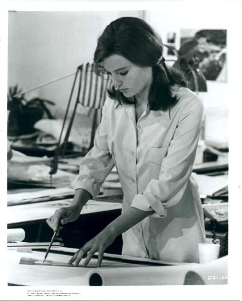 Jacqueline Bisset (as Cathy) at work in her office.